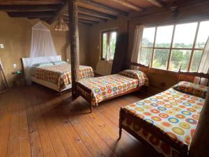 Zimmer mit 2 Betten und 2 Betten sidx sidx sidx sidx sidx in der Unterkunft Malva Rosa Relax La Juanita in José Ignacio