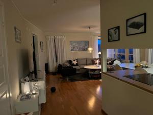 a living room with a couch and a table at Perfect location ski-in Åre in Åre