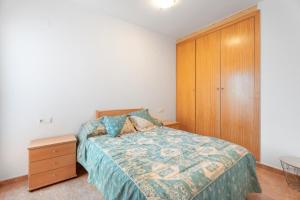 A bed or beds in a room at Herba Sana