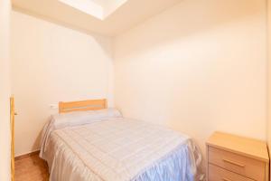 A bed or beds in a room at Herba Sana