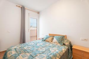 A bed or beds in a room at Herba Sana