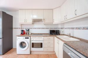 A kitchen or kitchenette at Herba Sana