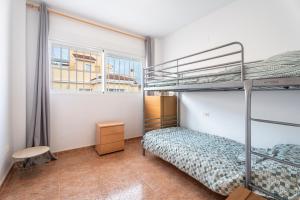 A bed or beds in a room at Herba Sana