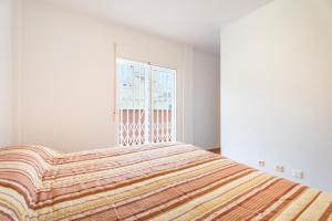 A bed or beds in a room at Herba Sana