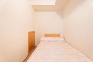 A bed or beds in a room at Herba Sana