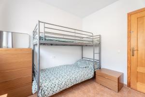 A bed or beds in a room at Herba Sana
