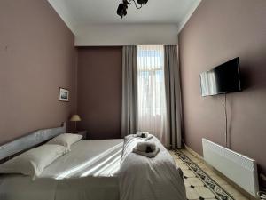 Posteľ alebo postele v izbe v ubytovaní Tinion Urban Hotel