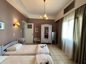 Posteľ alebo postele v izbe v ubytovaní Tinion Urban Hotel