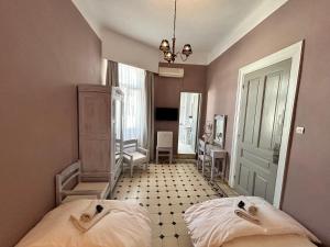 Posteľ alebo postele v izbe v ubytovaní Tinion Urban Hotel