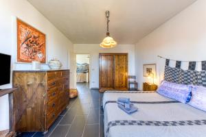 a bedroom with two beds and a dresser at Villa Olivia pool tennis spa Cielo in Lecce +36 photos