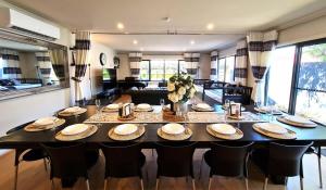 a dining room with a large table and chairs at Capel Sound OASIS Getaway in Capel Sound