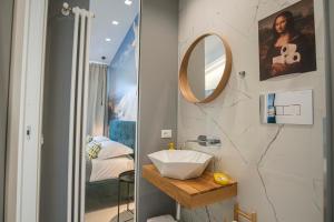 a bathroom with a sink and a mirror at Villa Masami b&b e casa vacanze in Favara +109 photos