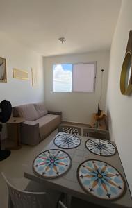 a living room with a stove and a couch at 1403 Apto 2 Qtos Cabedelo João Pessoa in Ilha da Restinga