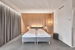 Un pat sau paturi într-o cameră la Four Points Flex by Sheraton Vejle