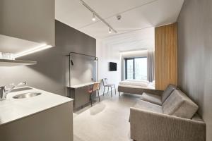 Un pat sau paturi într-o cameră la Four Points Flex by Sheraton Vejle