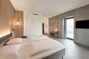 Un pat sau paturi într-o cameră la Four Points Flex by Sheraton Vejle