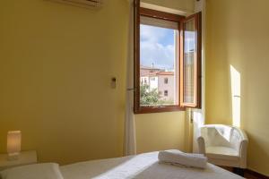 A bed or beds in a room at Apartments via Spano