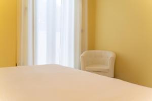 A bed or beds in a room at Apartments via Spano