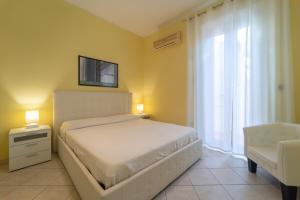 A bed or beds in a room at Apartments via Spano