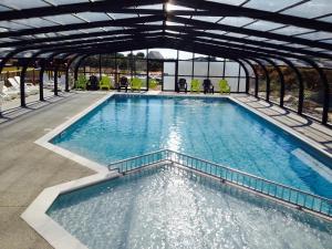a large pool of water in a building at Camping Lizoé in Pont-Croix