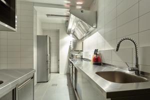 a kitchen with a sink and a refrigerator at Obidza 438 chata w górach in Obidza