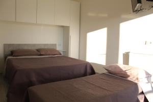Postel nebo postele na pokoji v ubytování Casamare Puglia