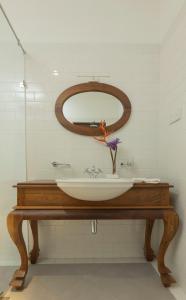 a bathroom with a sink and a mirror at Heritage Boutique by Seven Angels in Kandy +122 photos