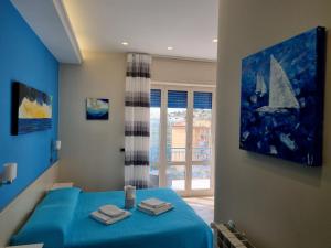 Postel nebo postele na pokoji v ubytování Oltre il Mare Guest House