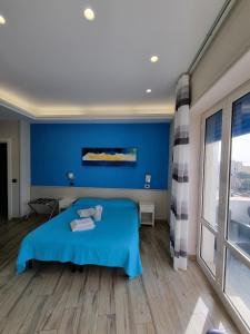 Postel nebo postele na pokoji v ubytování Oltre il Mare Guest House