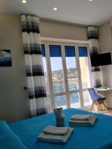 Postel nebo postele na pokoji v ubytování Oltre il Mare Guest House