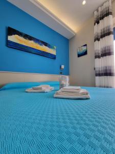 Postel nebo postele na pokoji v ubytování Oltre il Mare Guest House