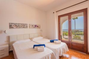 Ένα ή περισσότερα κρεβάτια σε δωμάτιο στο Villa Bautista +23 φωτογραφίες