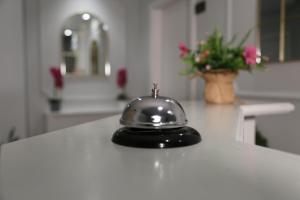a tea pot sitting on a white counter in a kitchen at Guesthouse Doanesia in Tirana