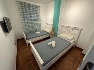 Ένα ή περισσότερα κρεβάτια σε δωμάτιο στο Sailor Home El Medano
