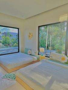 Ein Bett oder Betten in einem Zimmer der Unterkunft Jeju Homestay