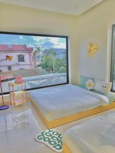 Ein Bett oder Betten in einem Zimmer der Unterkunft Jeju Homestay