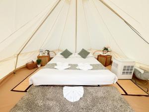 a bedroom with a bed in a tent at Thailand Mountain Phuket in Patong Beach