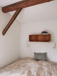 Postel nebo postele na pokoji v ubytování Blikgårdens summerhouse