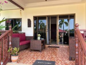 a living room with a couch and a table at Thailand Dream Village E09 in Klaeng