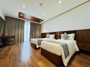 Gokulam Grand Kozhikode客房内的一张或多张床位
