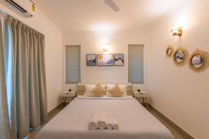 Postelja oz. postelje v sobi nastanitve Tranquil 1BHK suite Pool Field Calangute Da Alohas