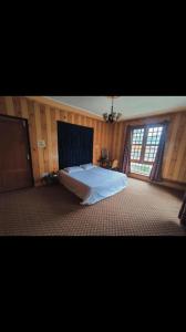 Postel nebo postele na pokoji v ubytování Busybee Guest House