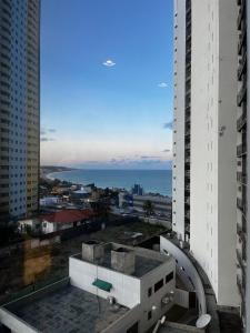 a view of the ocean from a building at Natal Suites - PontaNegra in Natal