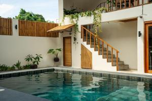 a house with a swimming pool and stairs at Moana Dive Resort in Panglao Island