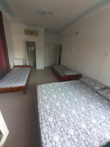 a room with two beds in a room at Huzur Pansiyon in Aydıncık +5 photos