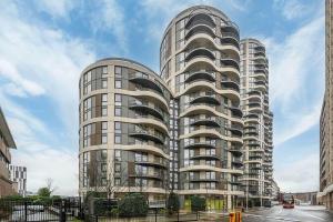 a large apartment building in a city at Private Room in Shared Flat with Stunning Views in Barking