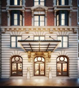 a facade of a building with awning and windows at HGU New York in New York