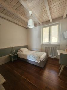 Postel nebo postele na pokoji v ubytování Relais diVINO