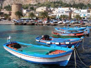 a row of boats are docked in a harbor at B&B Le Muse in Mondello