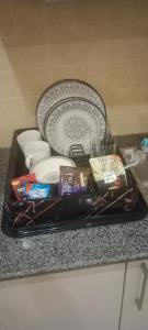 a tray with toothpaste and other items on a counter at bahria enclave apartments in Islamabad